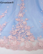 GeraniumGorgeous Light Blue Junior Ball Gown with Pink 3D Floral Applique & Oversized Bow | Off-Shoulder Tulle Dress KD-374